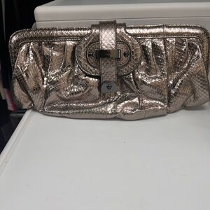 Metallic clutch bag